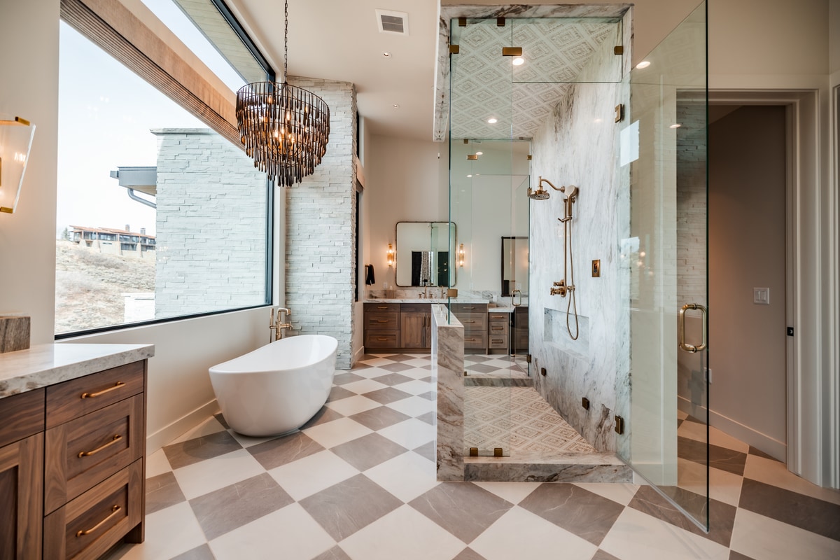 Pinnacle Lot 47 Park City Utah — primary bath with freestanding soaking tub, honed marble shower, and checkerboard tile floors