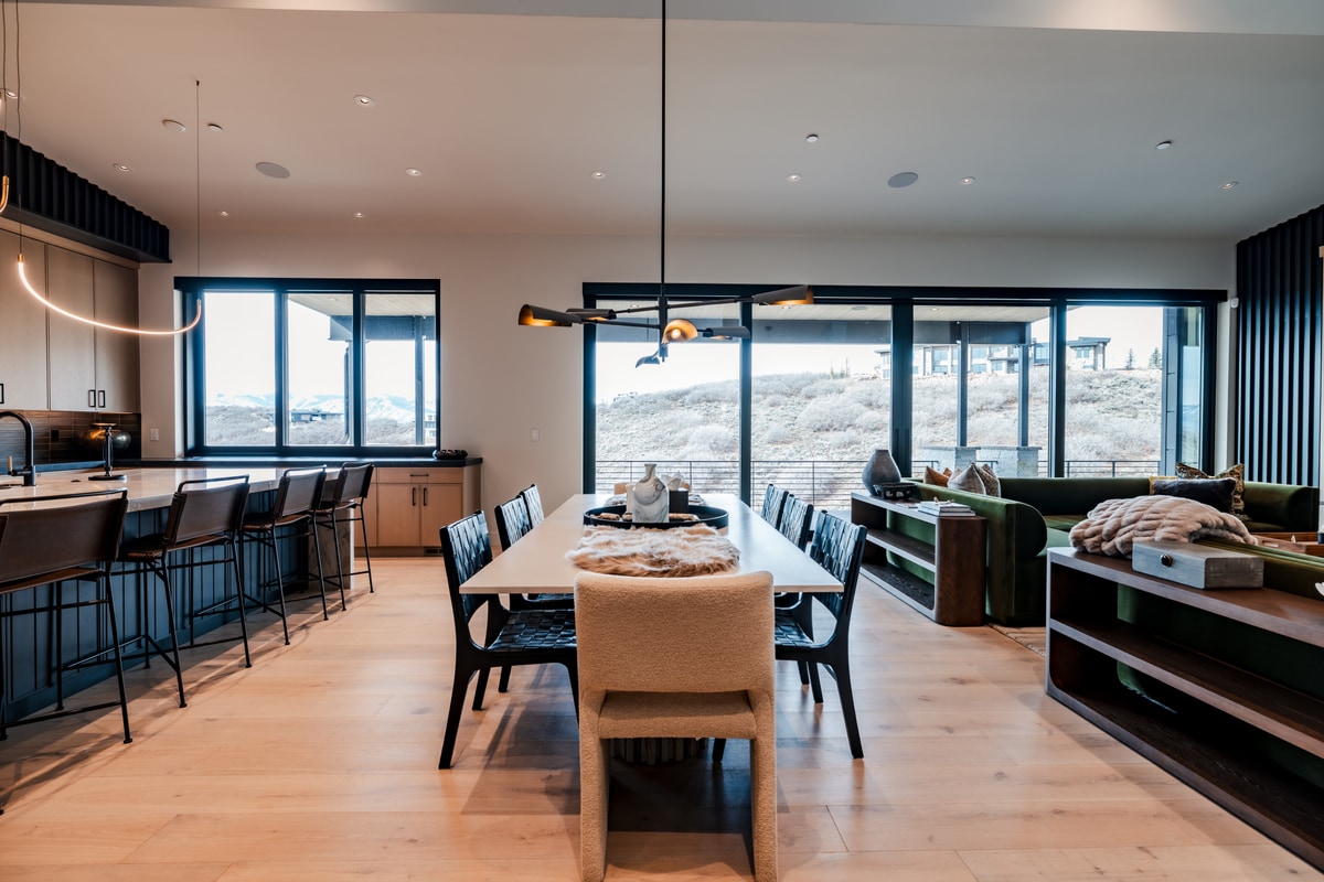 Pinnacle Lot 47 Park City Utah — wide-angle open-plan kitchen, dining, and living with white oak floors and mountain views