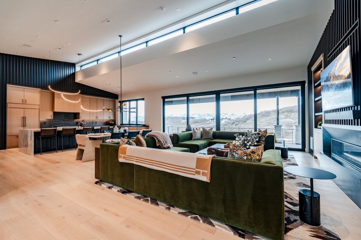 Pinnacle Lot 47 Park City Utah — open great room with wide-plank oak flooring, clerestory windows, and mountain views