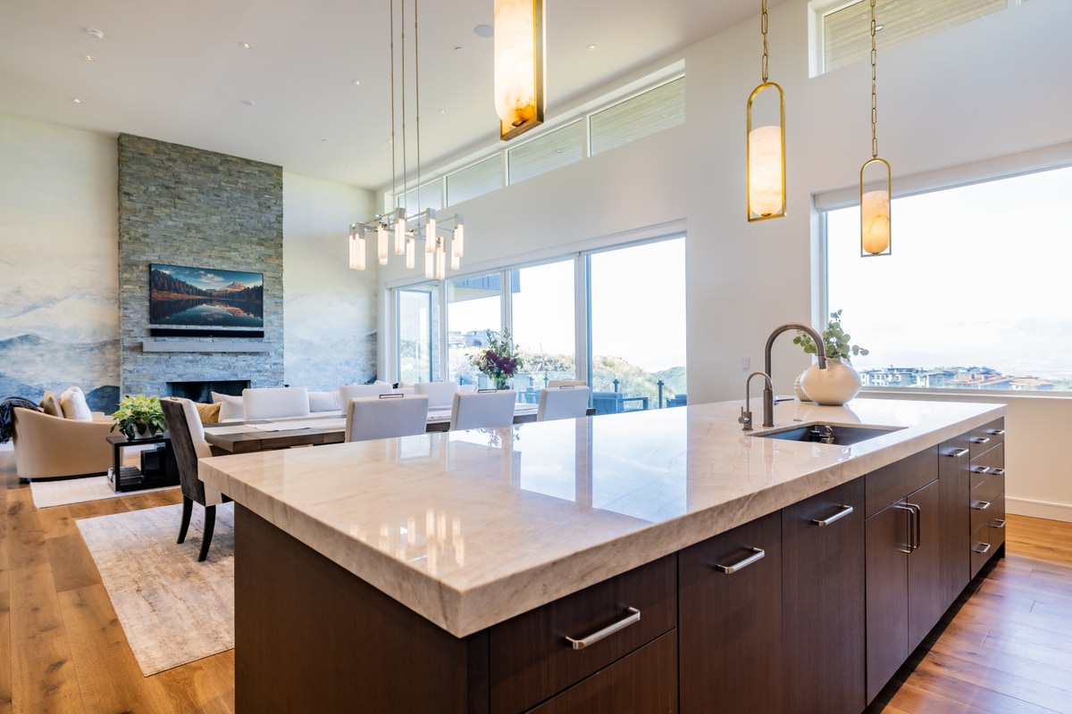 Promontory Lot 52 Park City Utah — chef's kitchen with waterfall-edge quartz island, espresso cabinetry, and mountain panorama