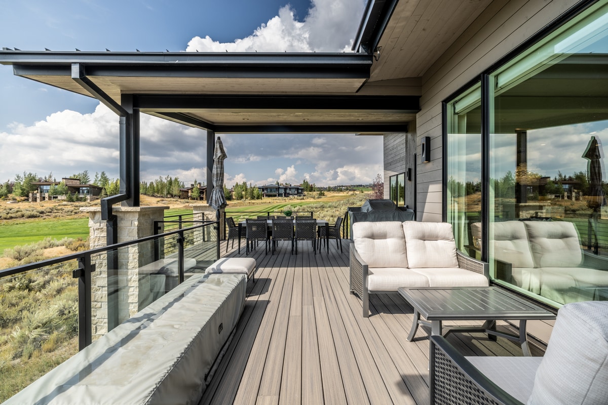 Ranch Gardens Park City Utah — covered outdoor living deck with composite decking, glass railings, and high-desert views